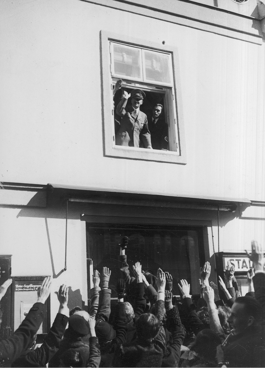 Adolf Hitler greets the crowd in Sankt Pölten, Austria
